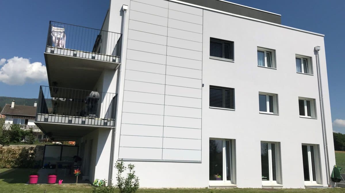 a white building with a balcony