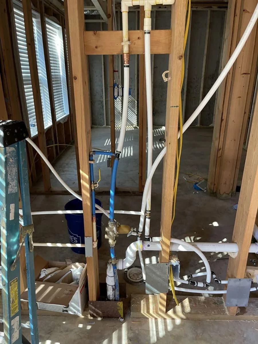 Plumbing and electrical rough-in in framed basement walls