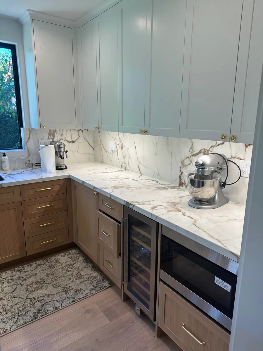 Finished kitchen cabinetry and integrated appliances