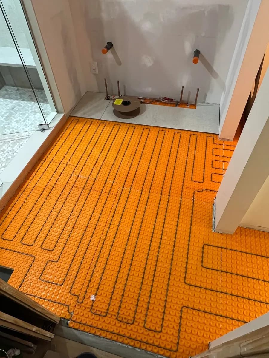 Heated floor mat installed before tile