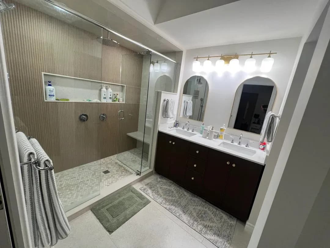Finished North Vancouver bathroom with double shower, vanity and glass enclosure