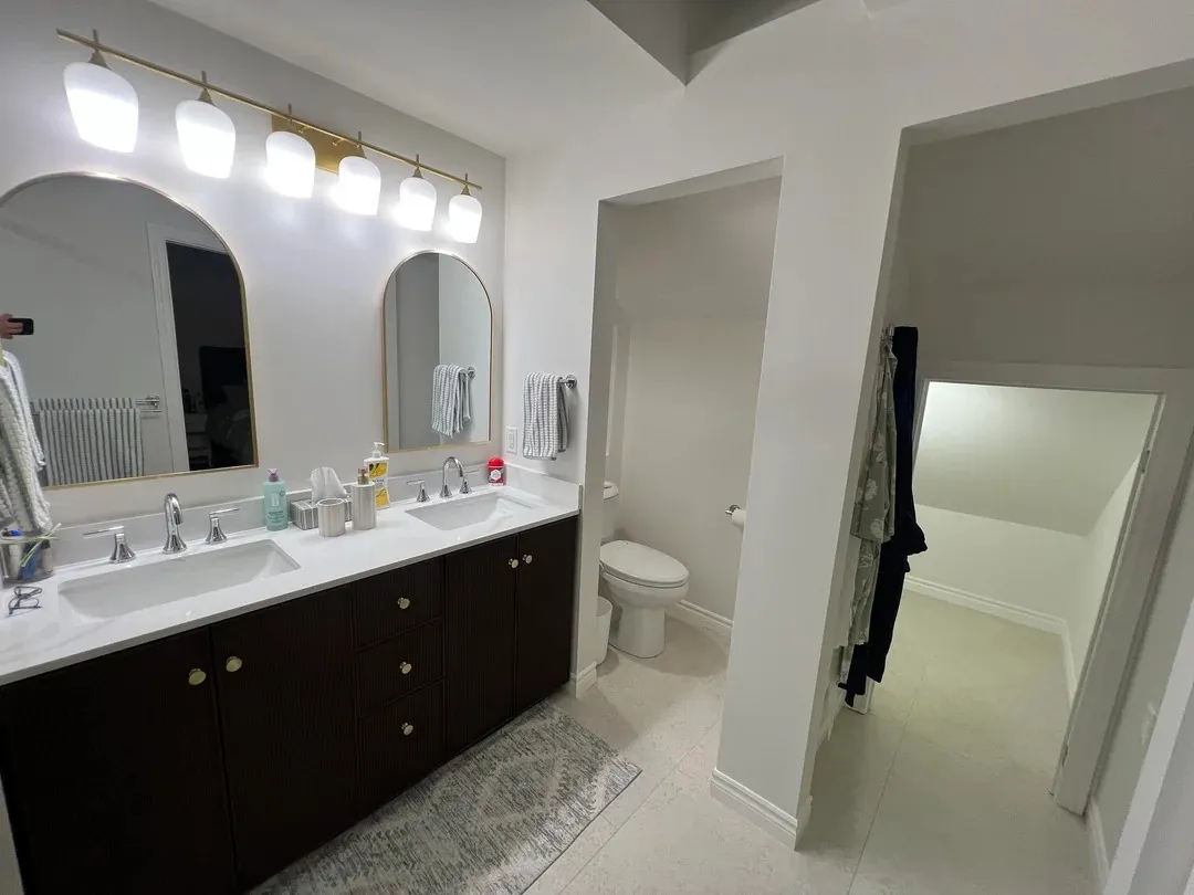 Renovated primary bathroom in North Vancouver with a larger double shower, updated vanity and bright finishes